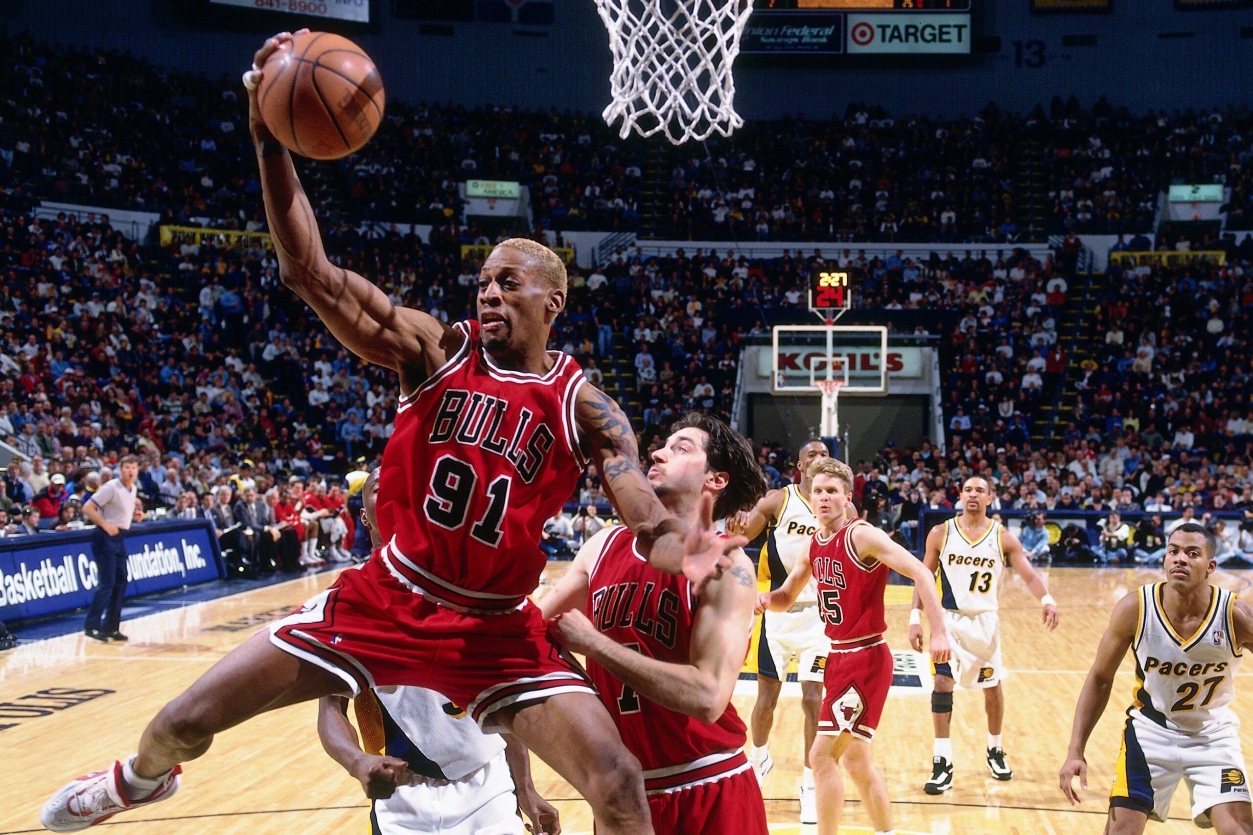 Dennis Rodman goes for a rebound