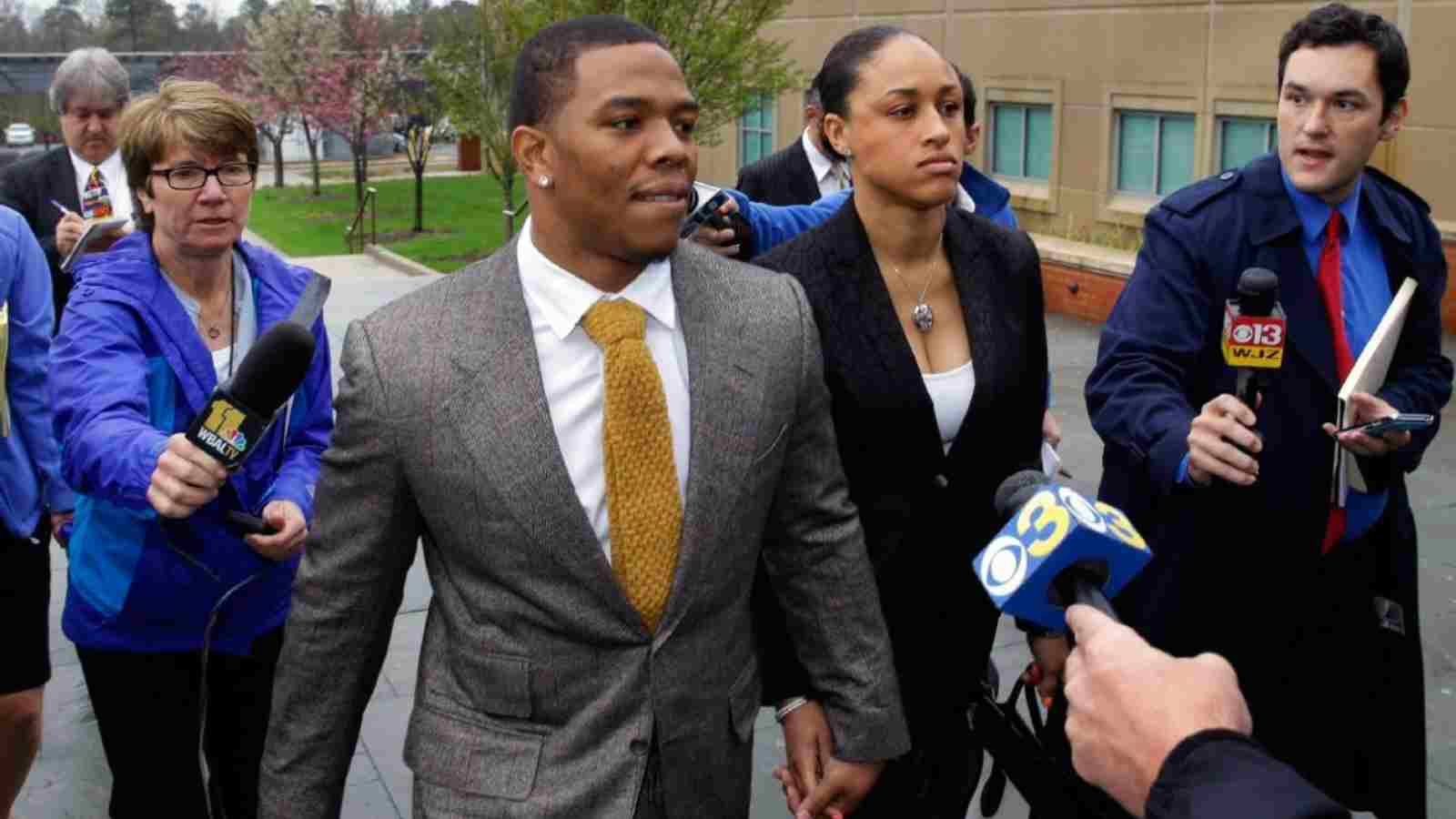 Ray Rice and his wife coming out of court