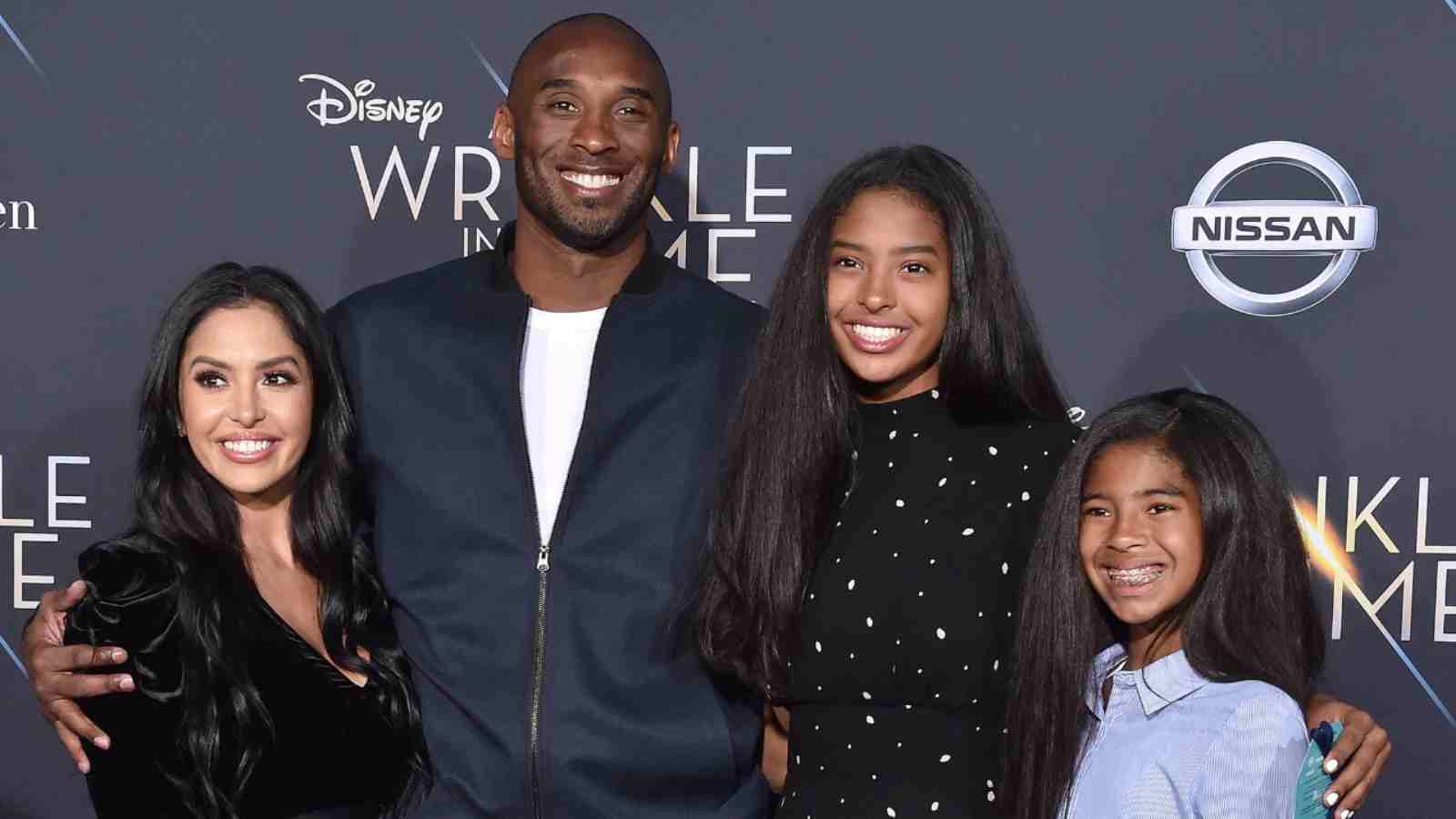 Vanessa Bryant and Kobe Bryant with their kids