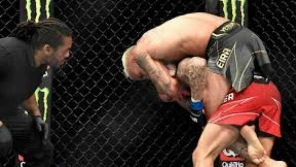 Charles Oliveira (on top) gets Dustin Poirier's back before eventually submitting him at UFC 269