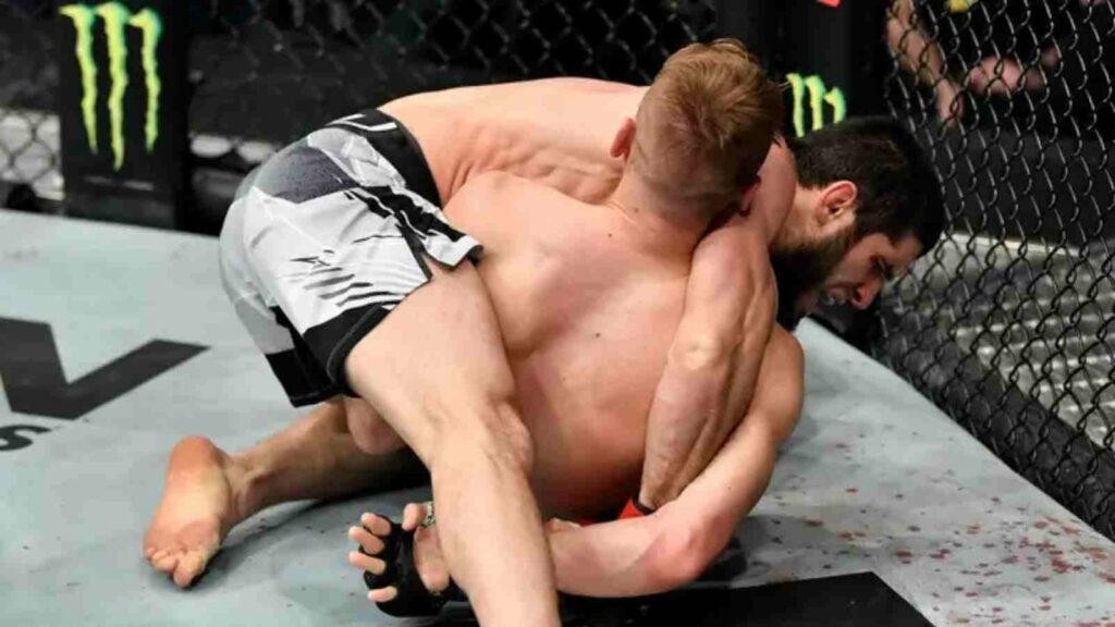 Islam Makhachev (on top) submits Dan Hooker in 2021