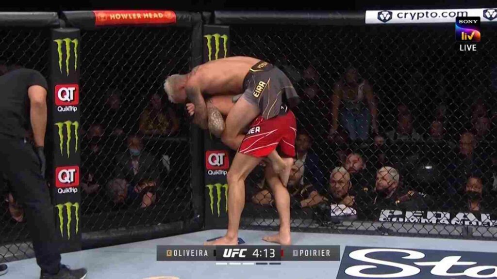 Charles Oliveira (in black shorts) submits Dustin Poirier