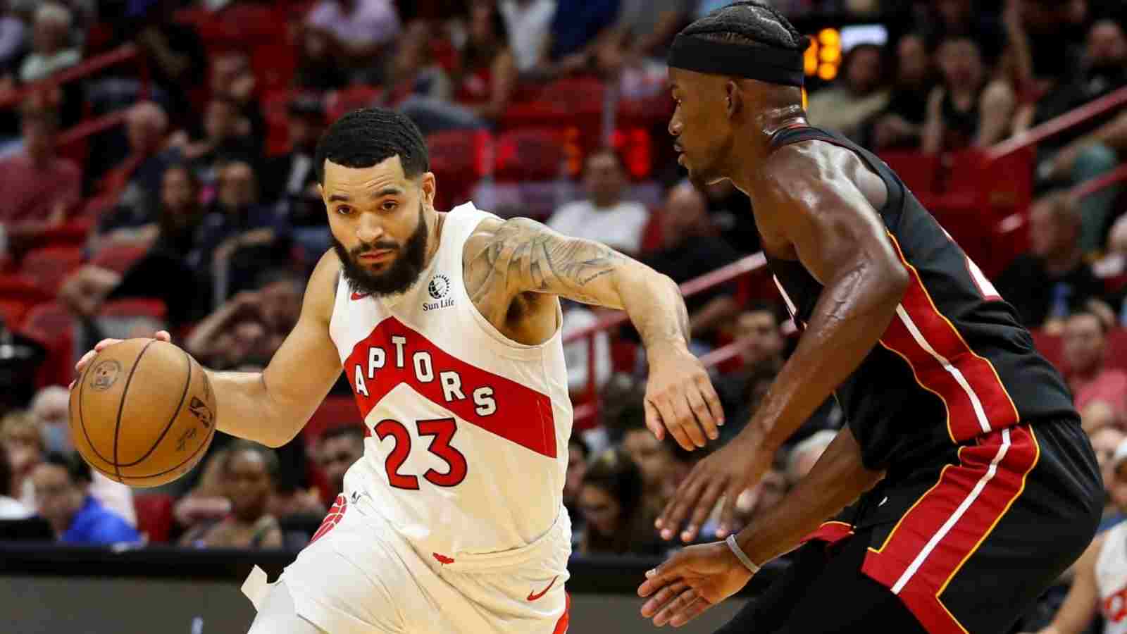 Fred VanVleet of the Raptors goes past Jimmy Butler of the Heat