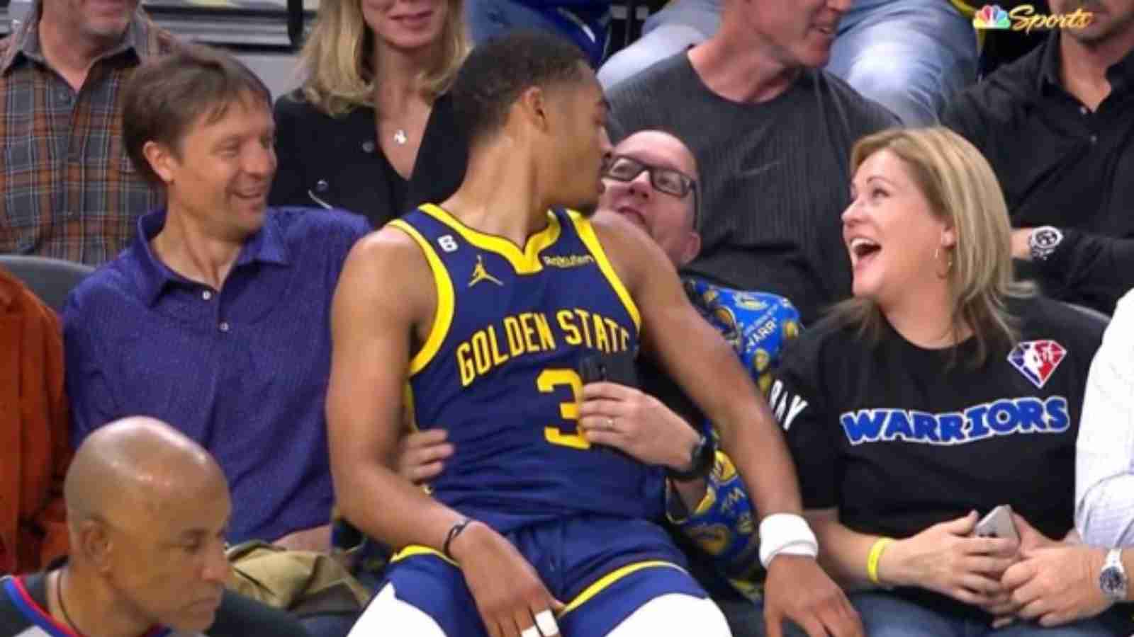 “I wanna be his chair” NBA Fans fight over Jordan Poole as he pleasingly sits on the lap of a courtside fan