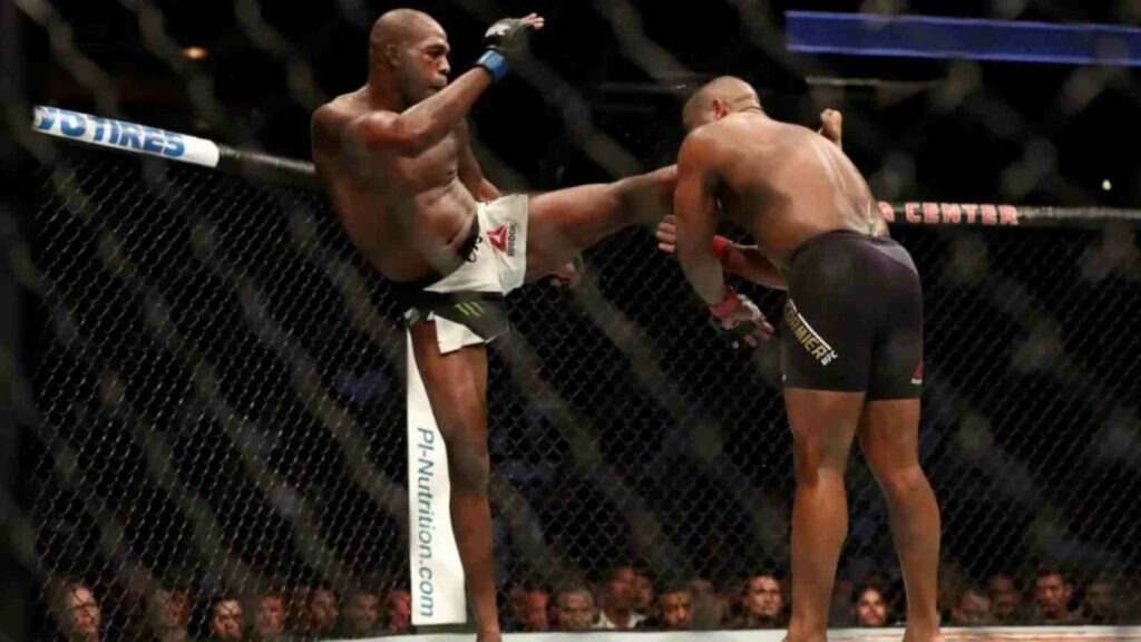 Jon Jones (L) headkicks Daniel Cormier en route winning the light heavyweight belt - the fight Mokaev referenced