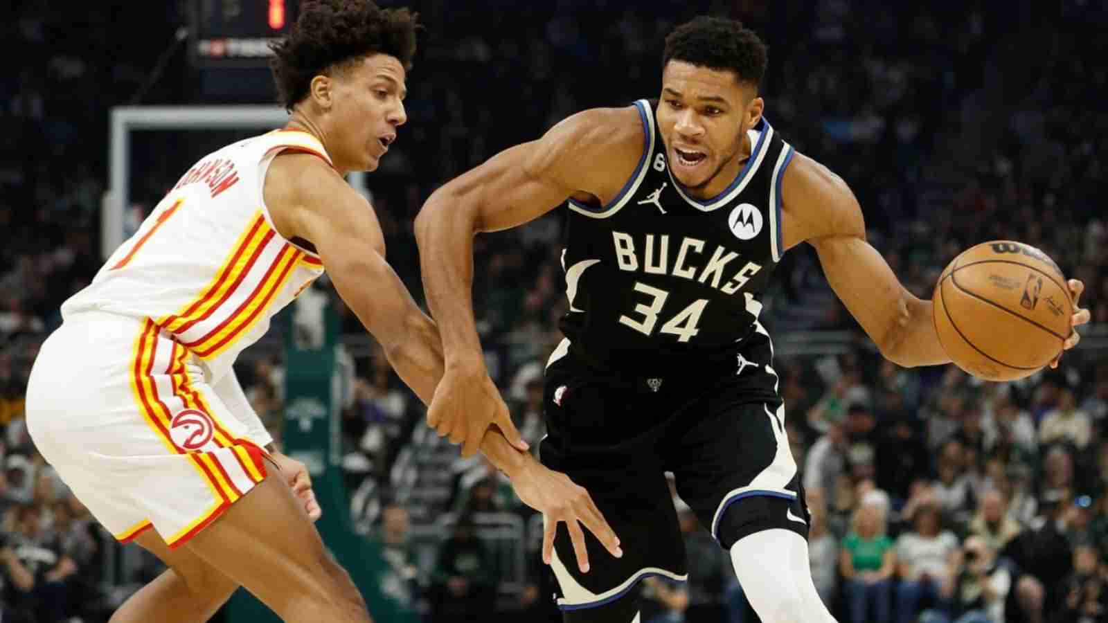 Giannis Antetokounmpo drives past Atlanta Hawks player