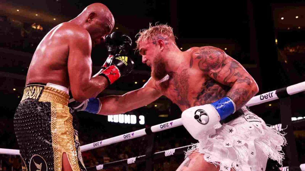 Anderson SIlva (L) and Jake Paul (R) in action last night