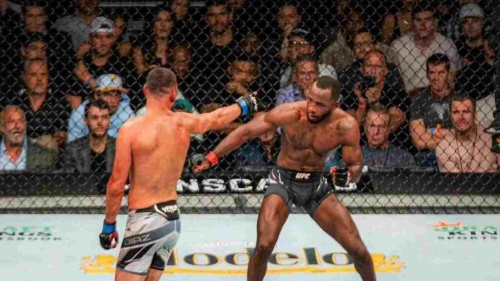 Nate Diaz (Grey shorts) stuns Leon Edwards (Black short) during their fight at UFC 263