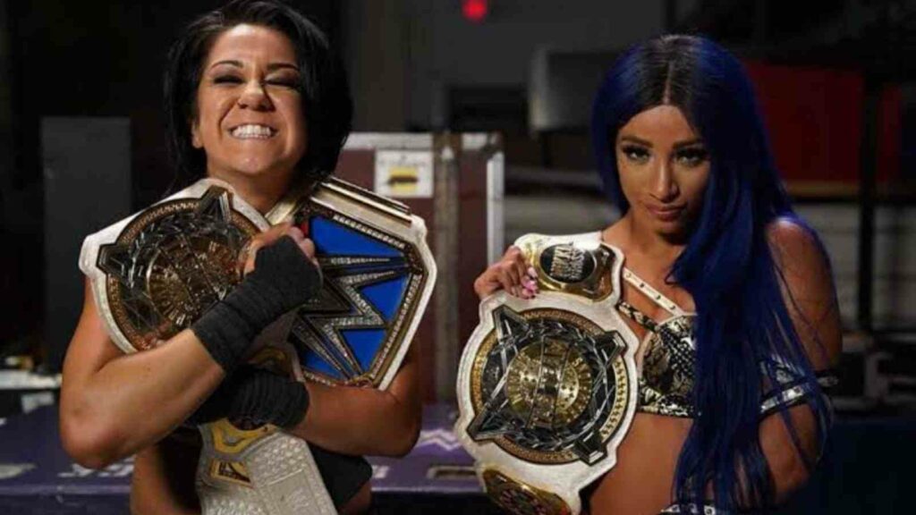 Bayley as SmackDown Women's Champion and Tag Team Women's Champion with Sasha Banks (Image Credits- Comicbook.com)