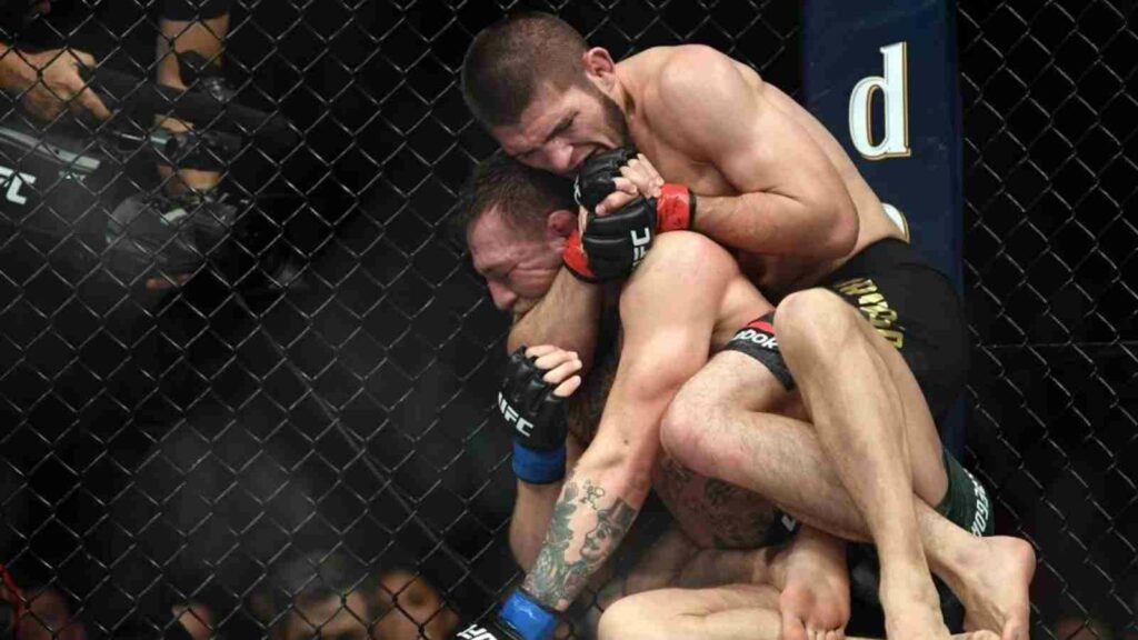 Khabib Nurmagomedov (on top) beats Conor McGregor in 2018.