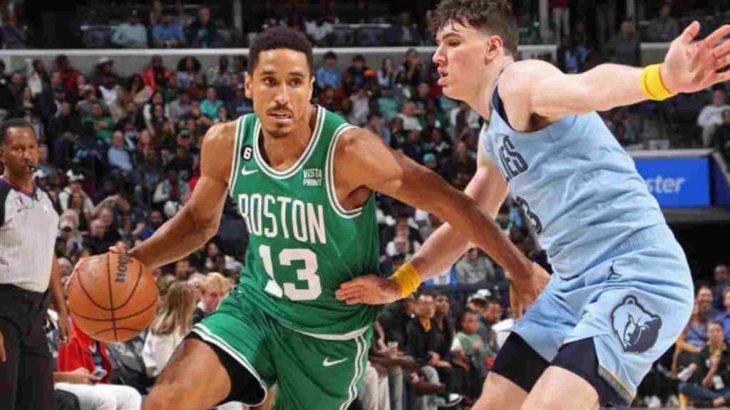 Malcolm Brogdon drives past Grizzlies player