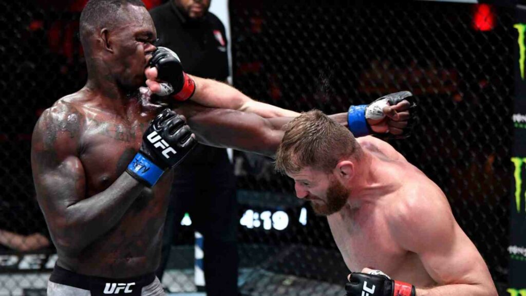 Israel Adesanya (L) battles Jan Blachowicz (R) in their light heavyweight title bout last year