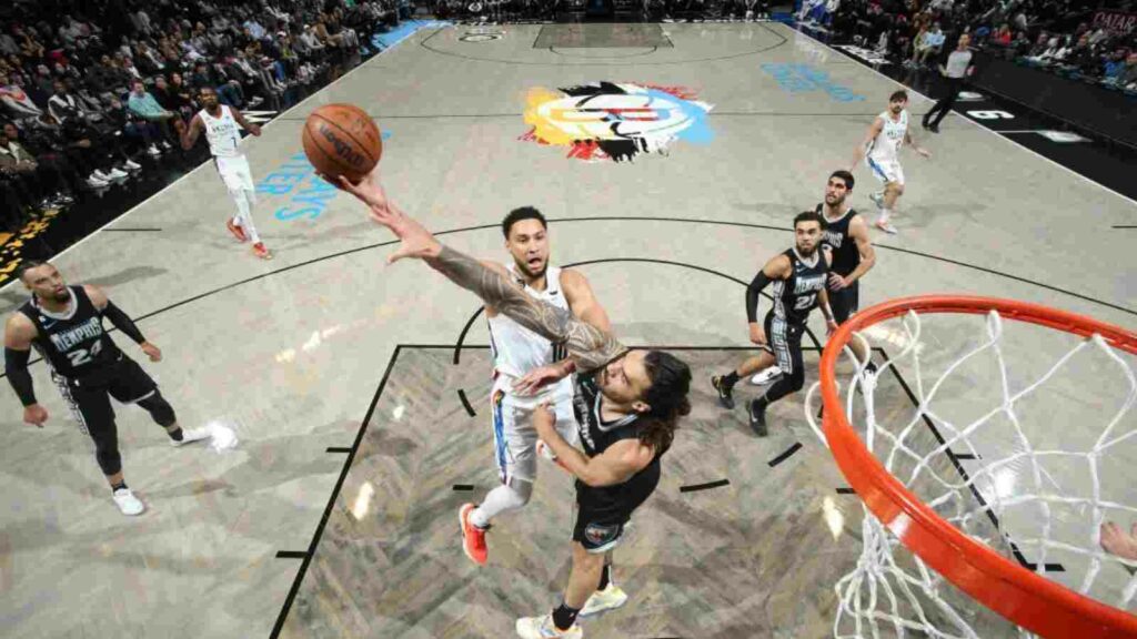 Ben Simmons shoots over Steven Adams