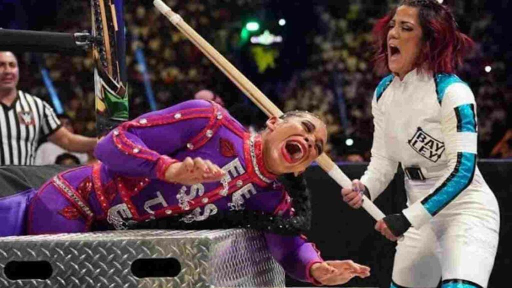 Bayley hits Bianca Belair with a Kendo stick during their match at Crown Jewel. (Image Credits- Ringside News)