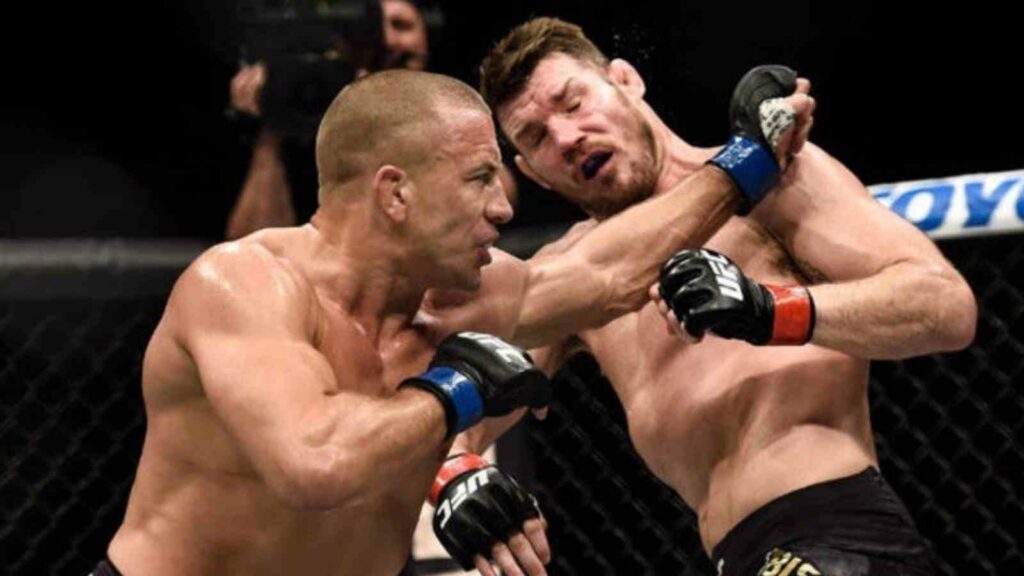 Georges St.Pierre (L) en route to beating Michael Bisping (R) in 2017 (Image Courtesy - The Fight City)