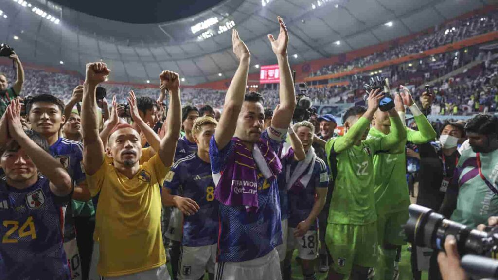 Japan's team celebrates their qualification in to the Round of 16 at the 2022 FIFA World Cup - IMAGO / Xinhua