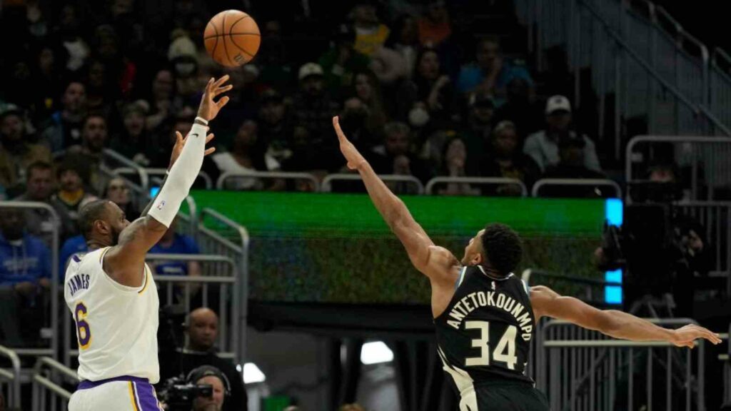 LeBron James attempts a shot over Giannis Antetokounmpo