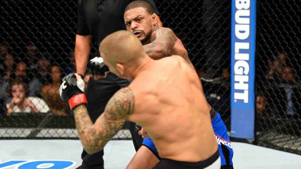 Michael Johnson (in blue trunks) delivers the scintillating KO of Dustin Poirier [Image Source - UFC]