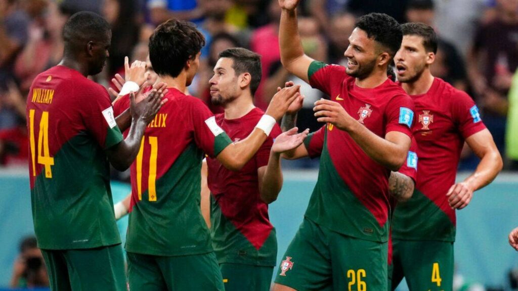 Portugal players celebrate after a goal.