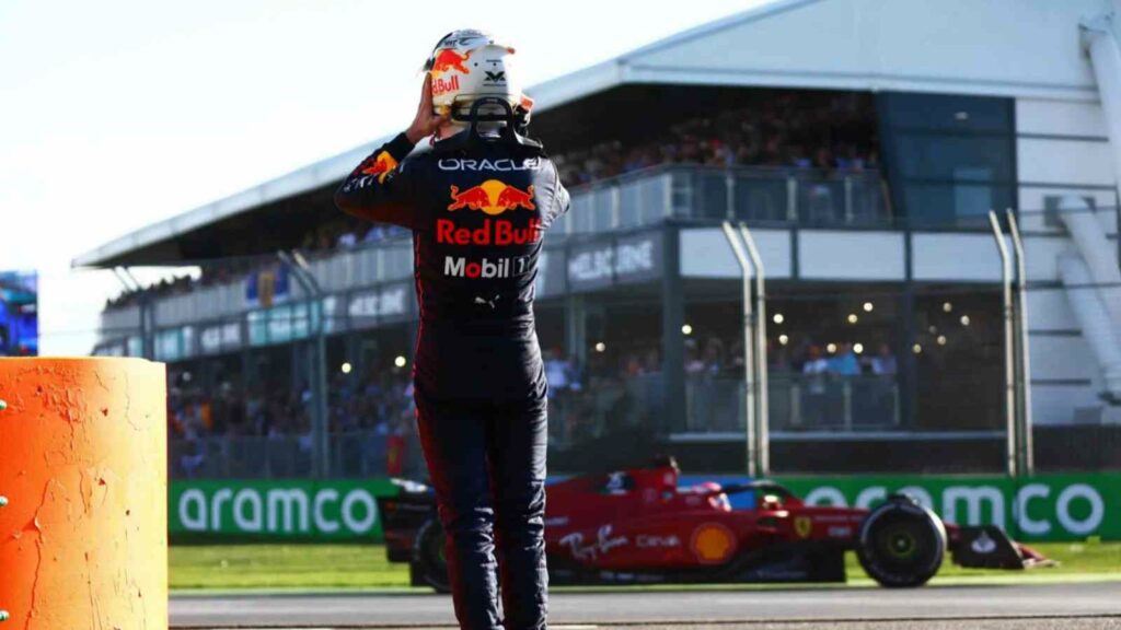 Max Verstappen watches Charles Leclerc drive past him after retiring at the Australian Grand Prix