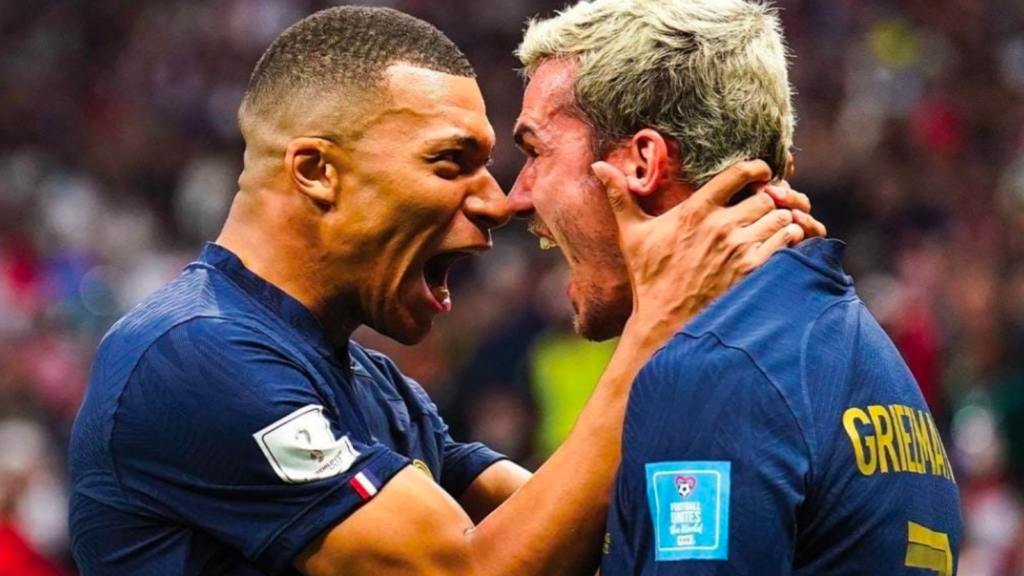 Kylian Mbappe celebrating with Antoine Griezmann