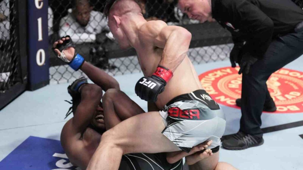 Drew Dober (in grey shorts) pummels Terrance McKinney en-route his victory [Image Source - MMA Mania]