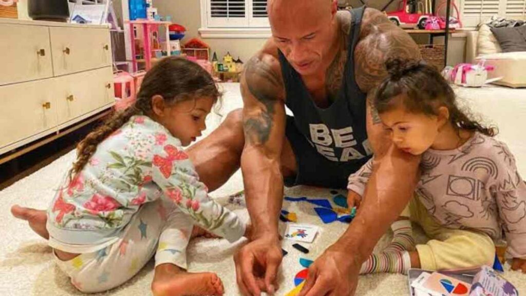 The Rock with his daughters